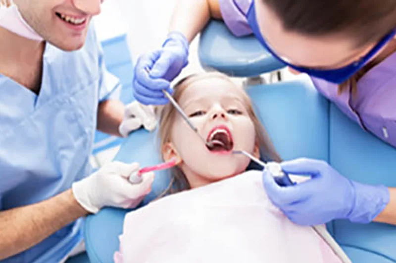A child enjoying a gentle first dental visit