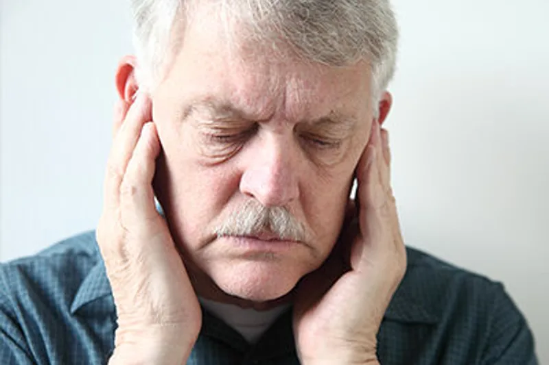 Patient holding a sore jaw